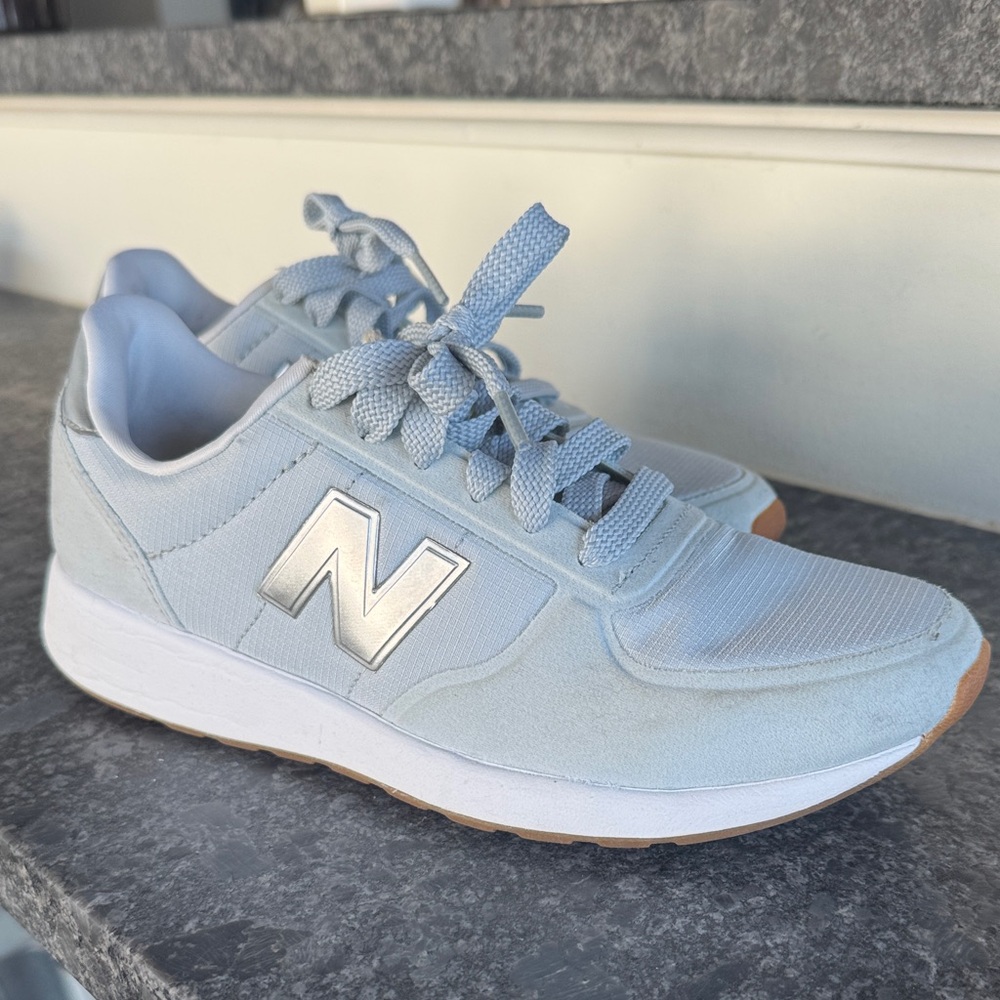 New Balance Sky Blue Sneakers with Silver Logo
